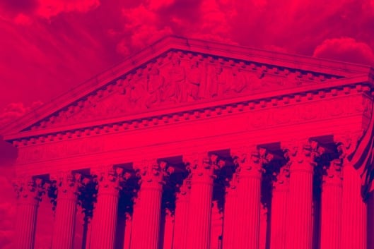 Facade of U.S. Supreme Court with a red-colored filter applied.