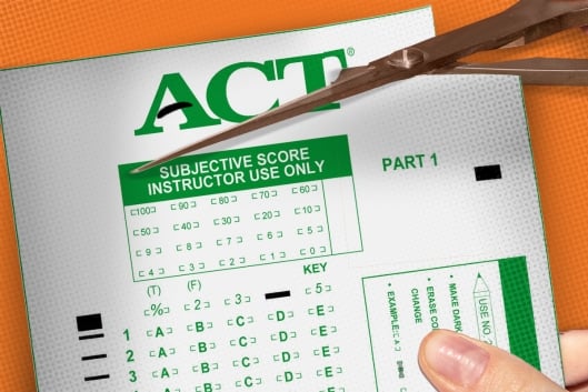A Scantron being cut with scissors