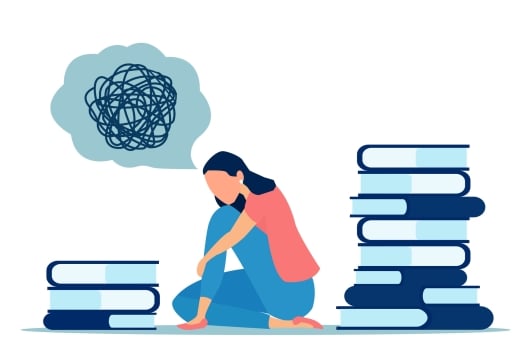 Young woman sits surrounded by books looking sad with a thought bubble above her that is full of scrambled lines