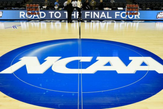 Basketball court with NCAA logo at halfcourt