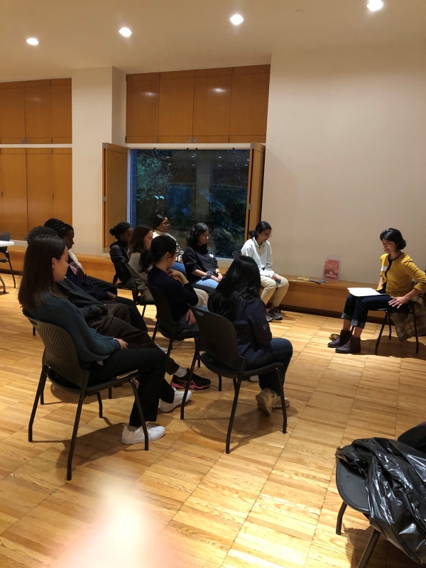 Emily Dunuwila leads a group of students in a guided meditation session at Cornell University.