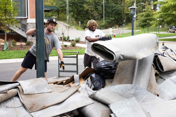 Students toss damaged carpets