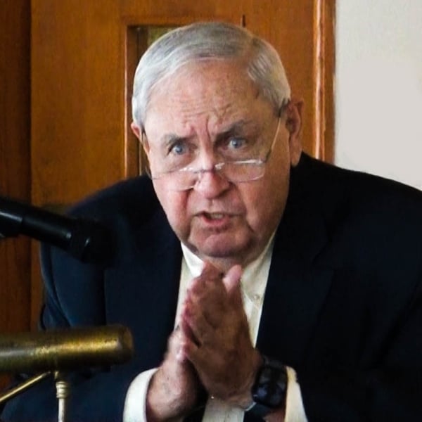 Bill Bowe, an older white man with gray hair and small frameless glasses perched on his nose.