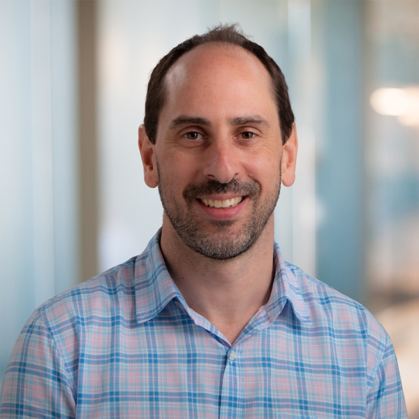 Fernando Bleichmar, a light-skinned man with a goatee and dark hair wearing a checked button-down shirt.