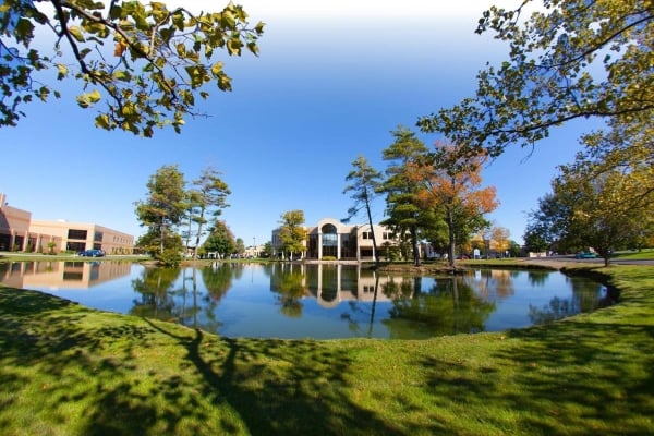 A college campus with a lake in the middle