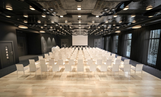 Huge, glossy conference room with dozens of empty chairs