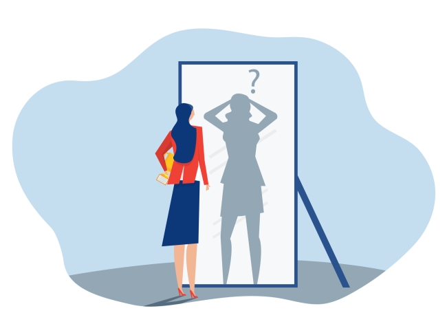 Woman in professional clothes looks at shadow of herself in mirror looking anxious with a question mark above her head