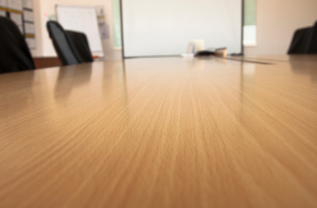 An empty conference room table.