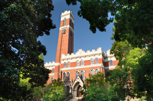 A Vanderbilt University campus building, surrounded by leafy trees.