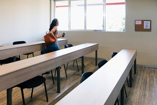 A student leaving a classroom.