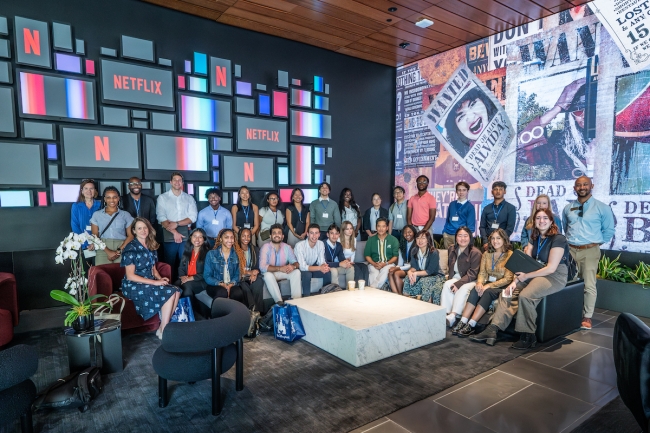 A group of students and alumni from Emory University smile for a photo in Los Angeles