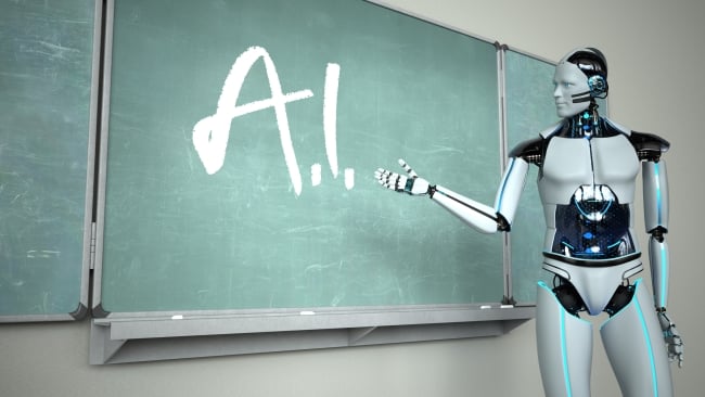 A shiny silver human-like robot stands pointing at a green chalkboard, where "A.I." is written in white chalk.