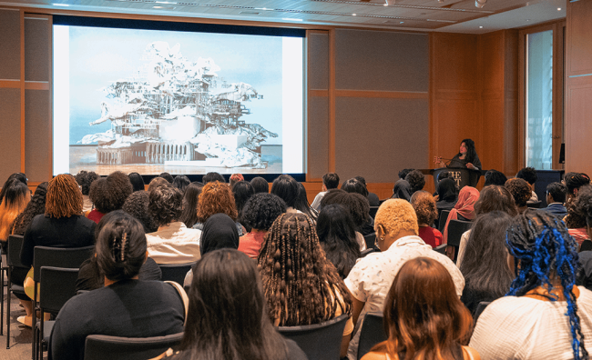 The 2023 cohort of New York City Bloomberg Arts Internship students watch a presentation at the Metropolitan Museum of Art.