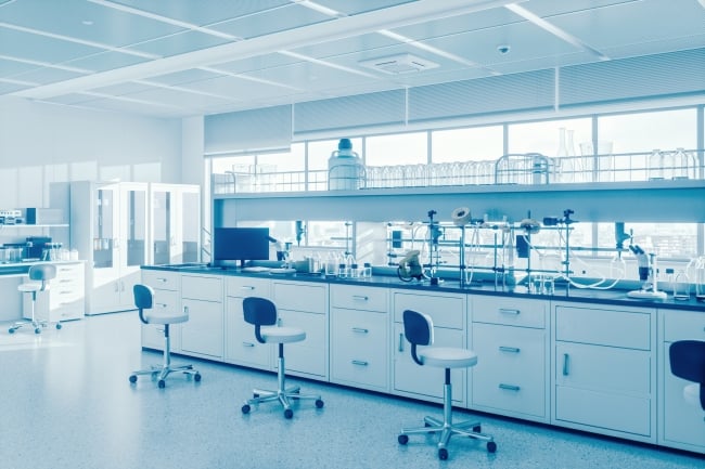 A silver-toned photo of a gleaming, modern empty science laboratory.