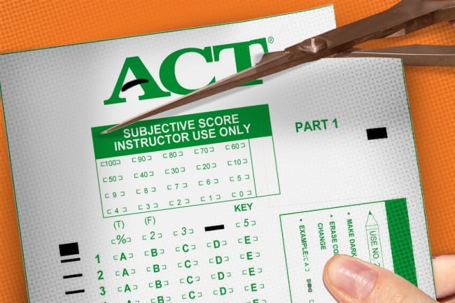 A Scantron being cut with scissors