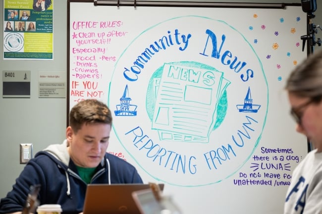 Students working in the community news room
