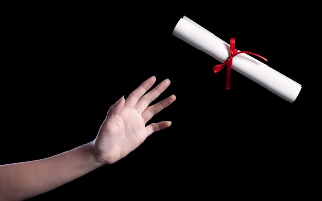 hand reaching for a diploma