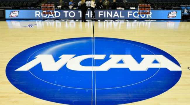 Basketball court with NCAA logo at halfcourt