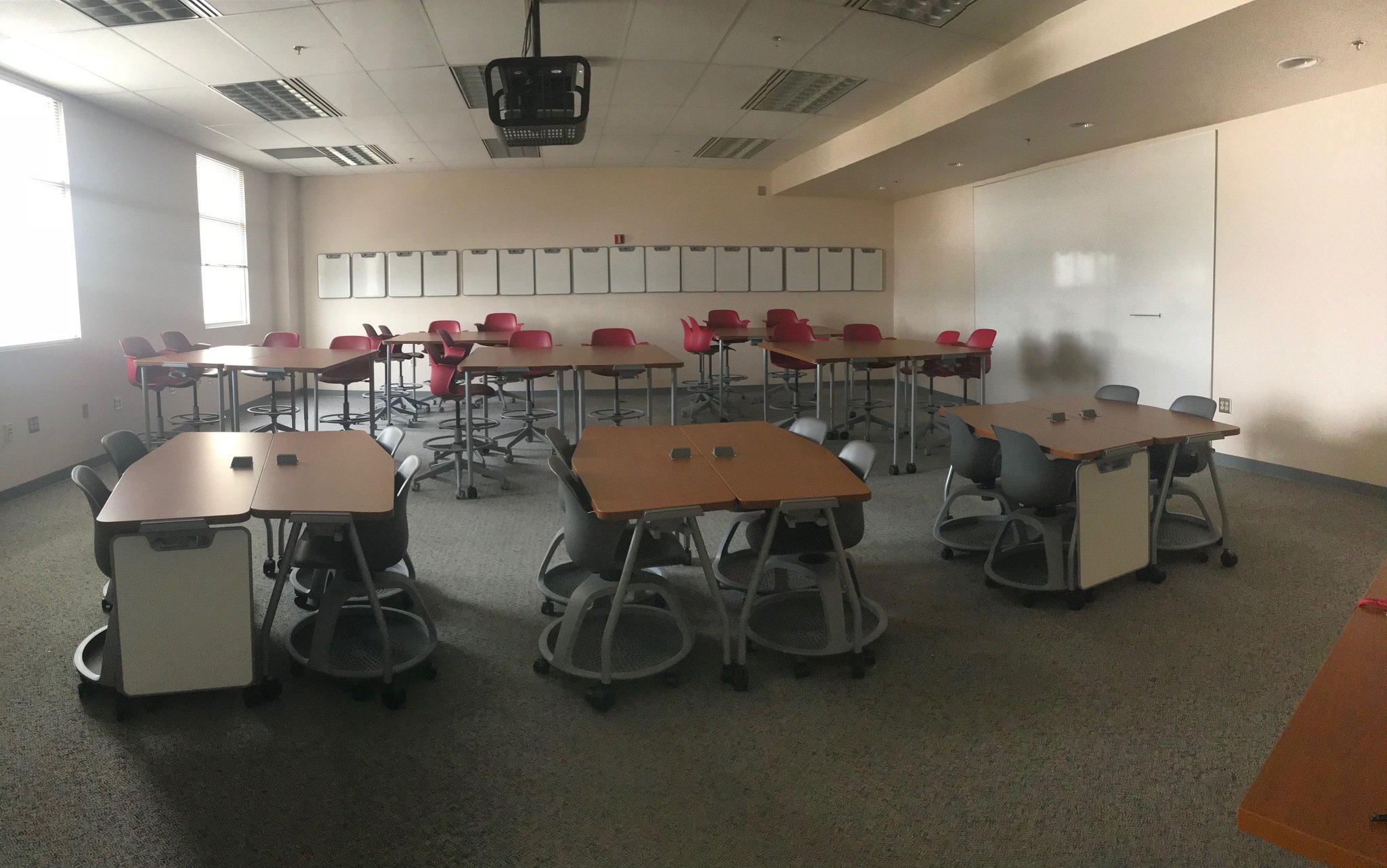 Tables and chairs arranged in an "active learning classroom" layout at New Mexico State